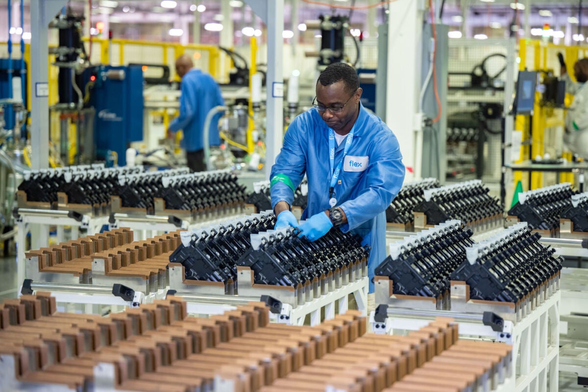 Flex employee on Enphase microinverter production line